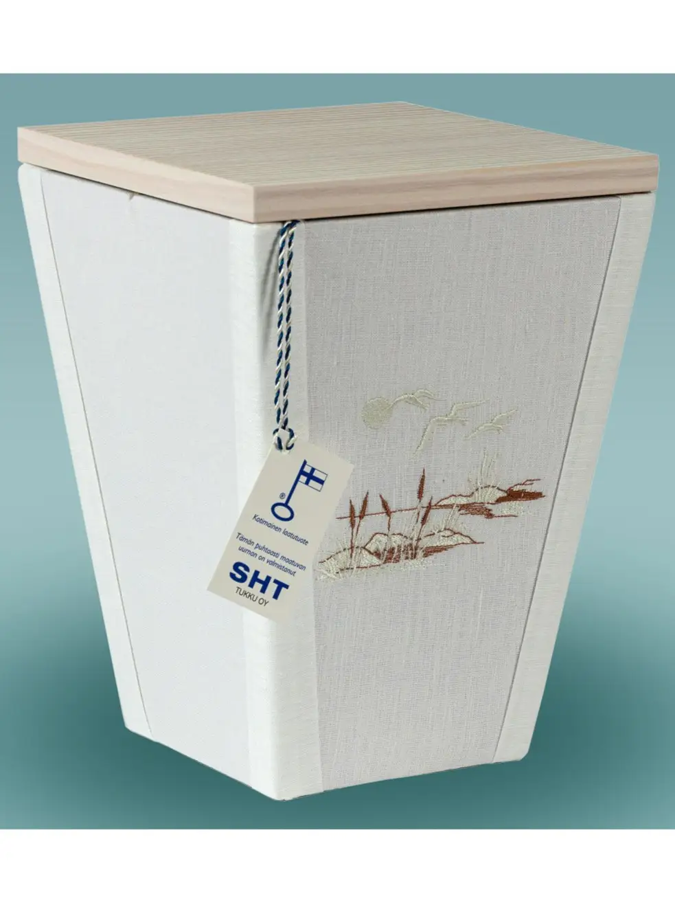 Ranta uurna Vaaleapellavainen hautauurna, jossa brodeerattu rantamaisema – alaspäin kapeneva muoto ja käsityönä valmistettu Punkalaitumella.